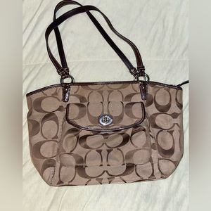 Brown/khaki Coach Signature logo textile jacquard handbag.